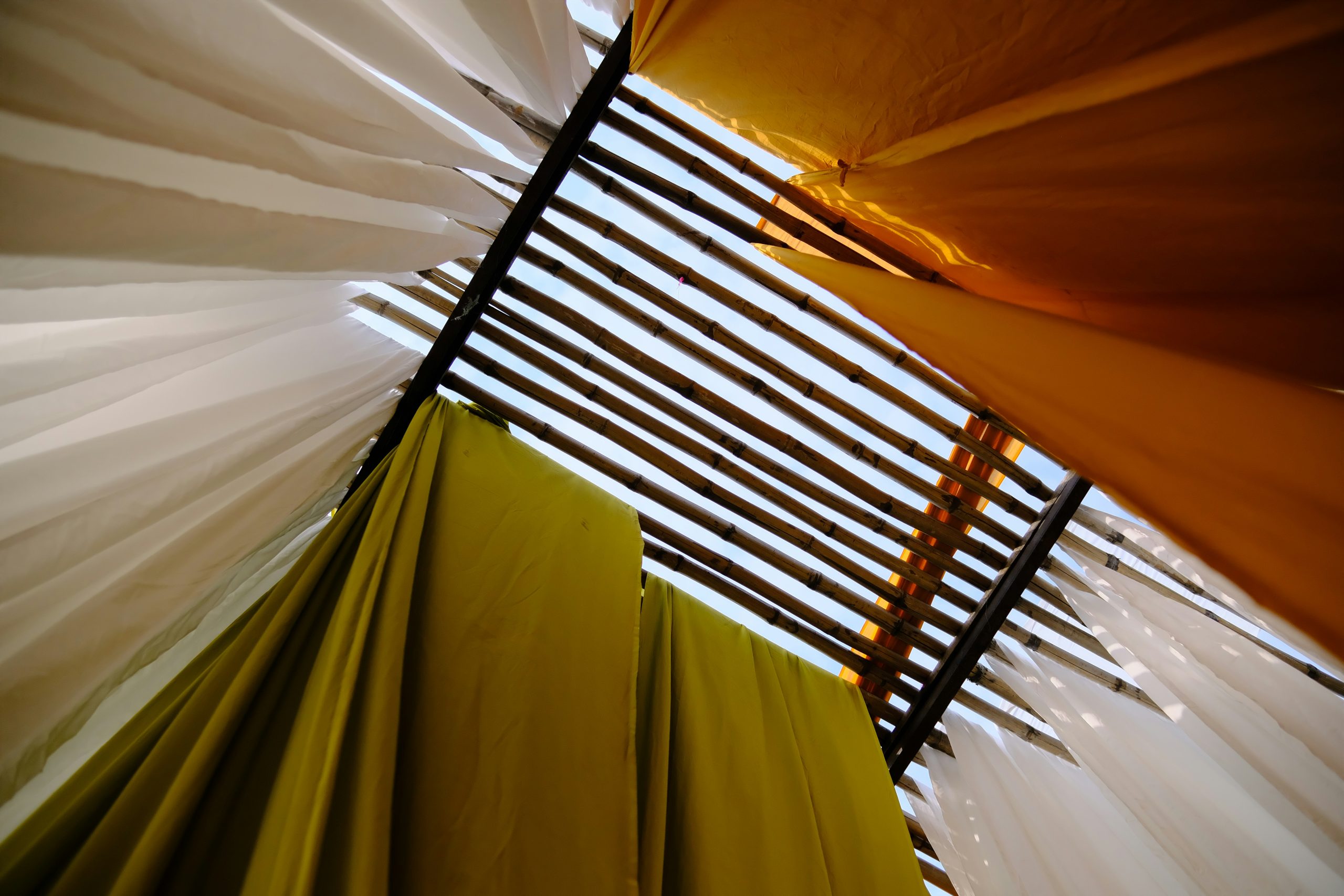 Floor-length bespoke curtains framing a bright living-room window