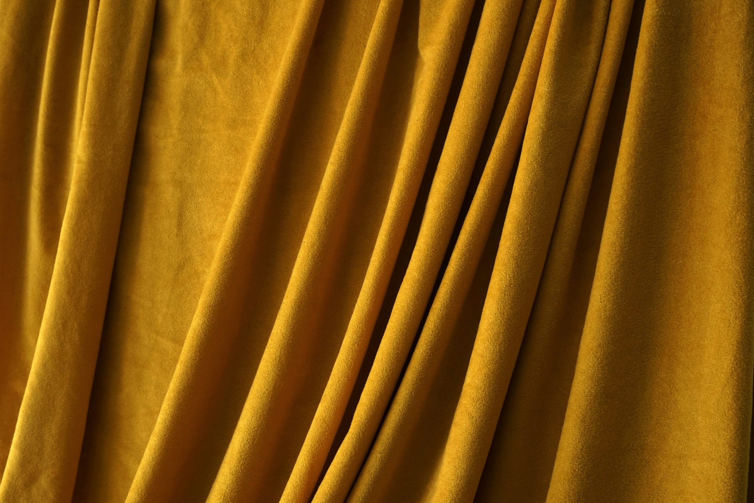 Blockout curtains drawn across a bedroom window, blocking daylight